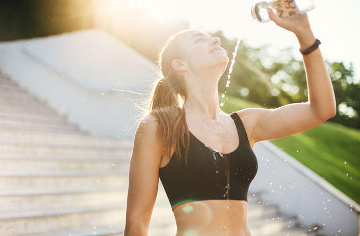 Woman hydrating herself